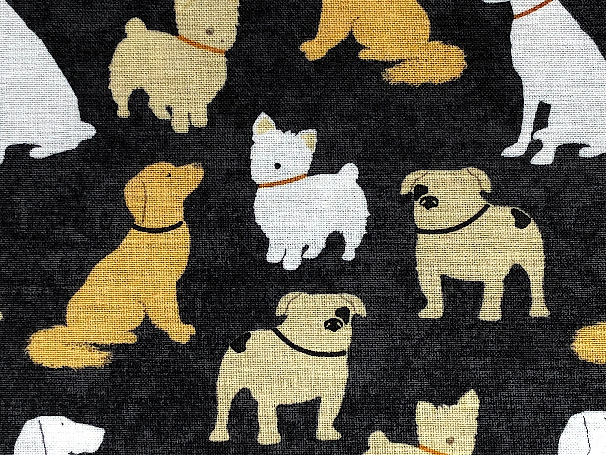 This black fabric by Wilmington Prints is covered with dogs of all breeds