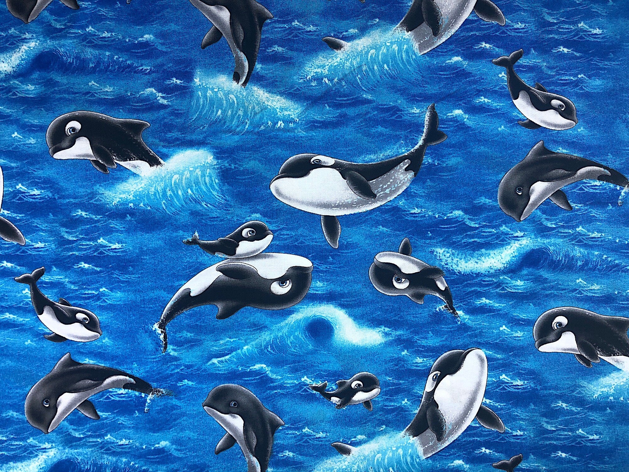 This water fabric is covered with playful whales jumping and enjoying the day.