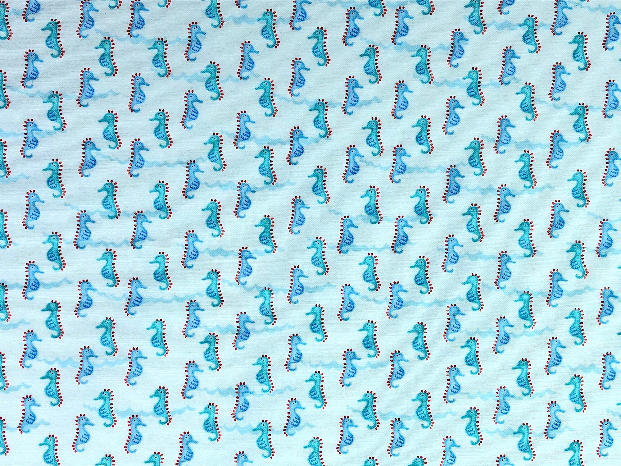 This sea life fabric is covered with Sea Horses moving back and forth on the fabric.