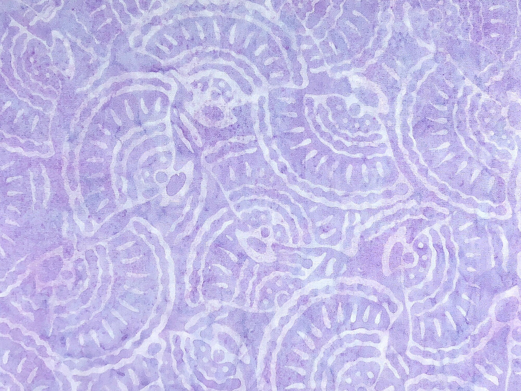 Close up of purple and white batik fabric.