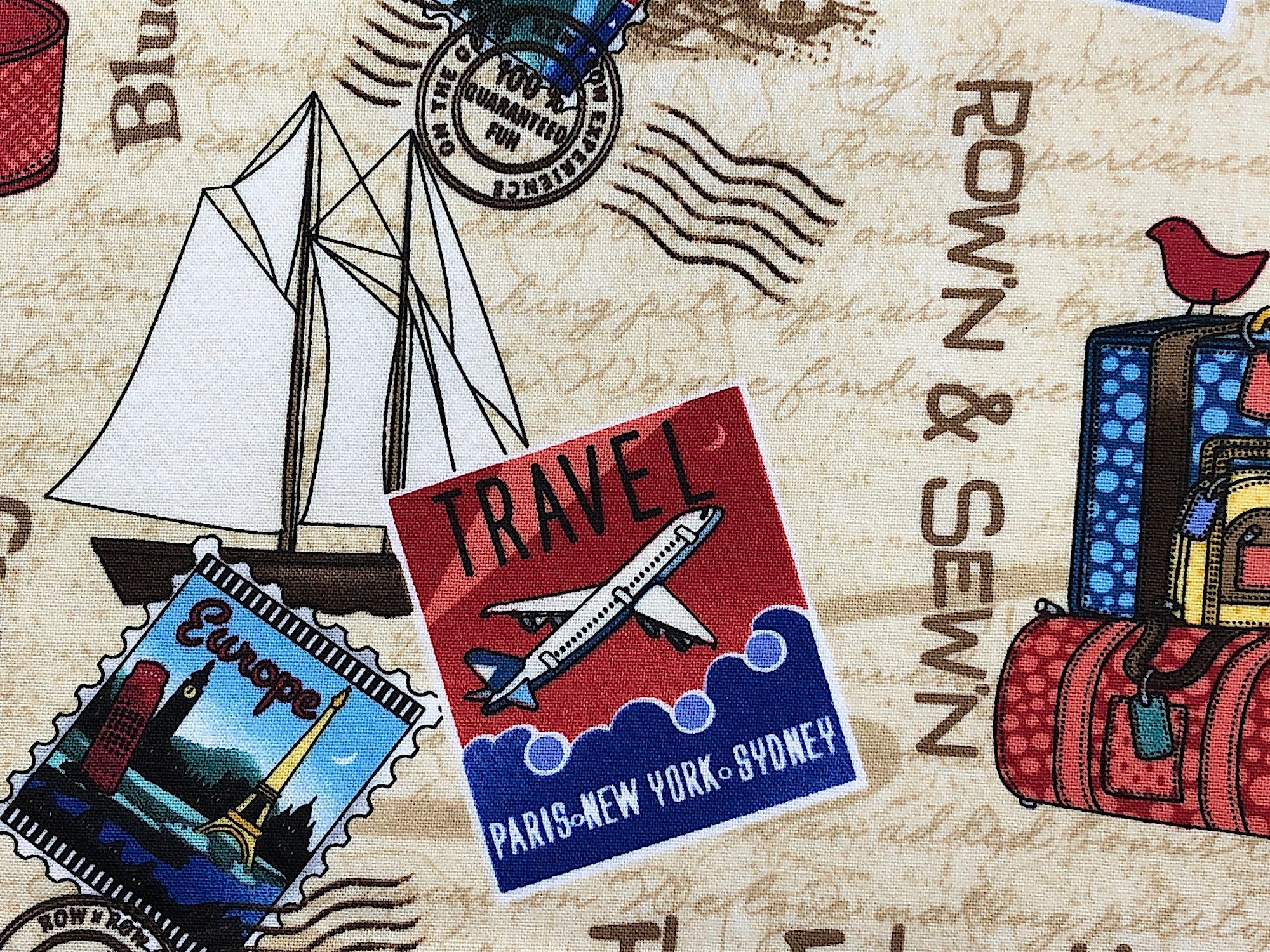 Close up of  a sail boat, stamp and Rown & Sewn.