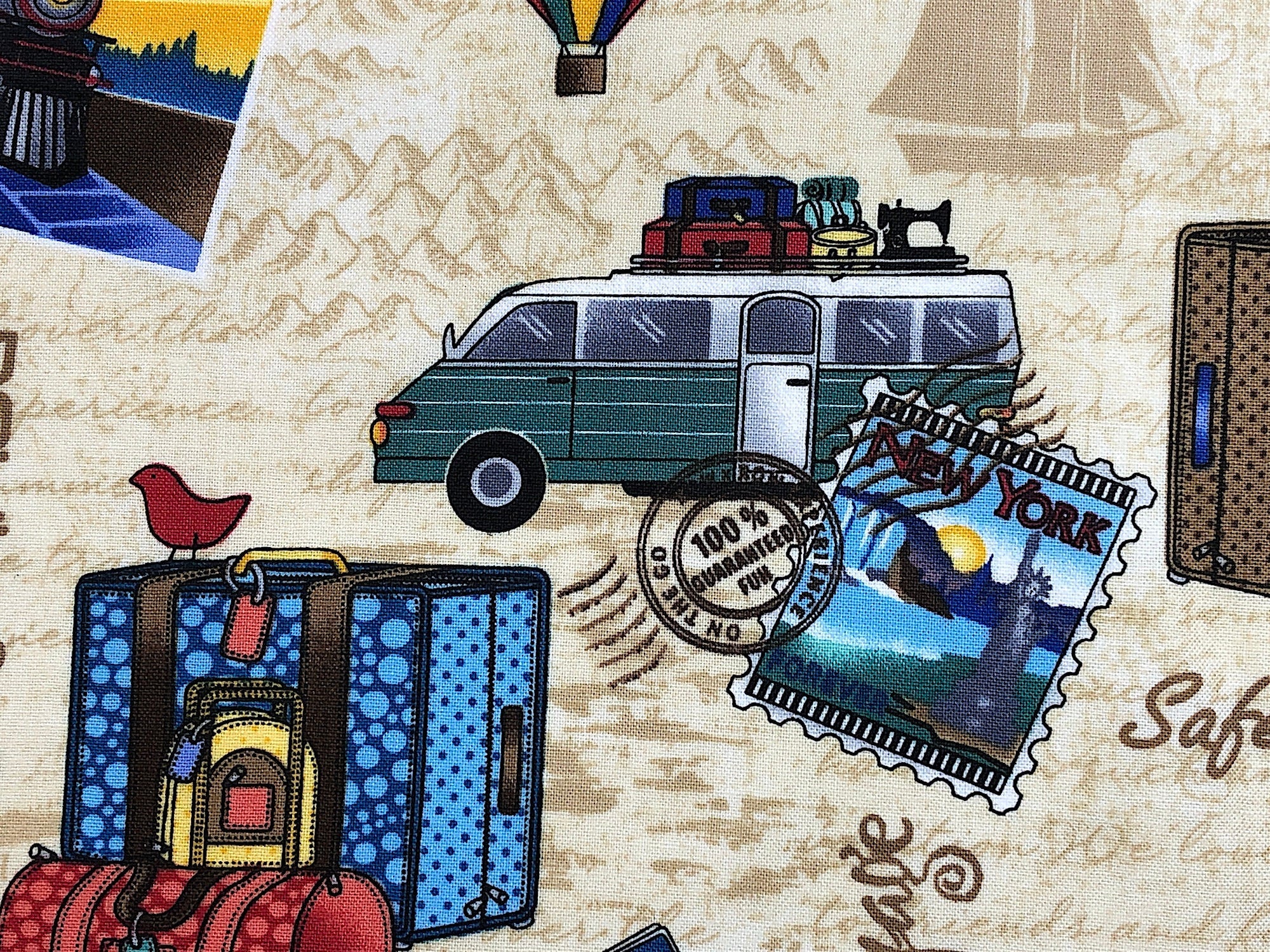 Close up of a van with luggage and a sewing machine on top.