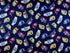 This blue fabric is covered with white, yellow, blue, red and green travel trailers.