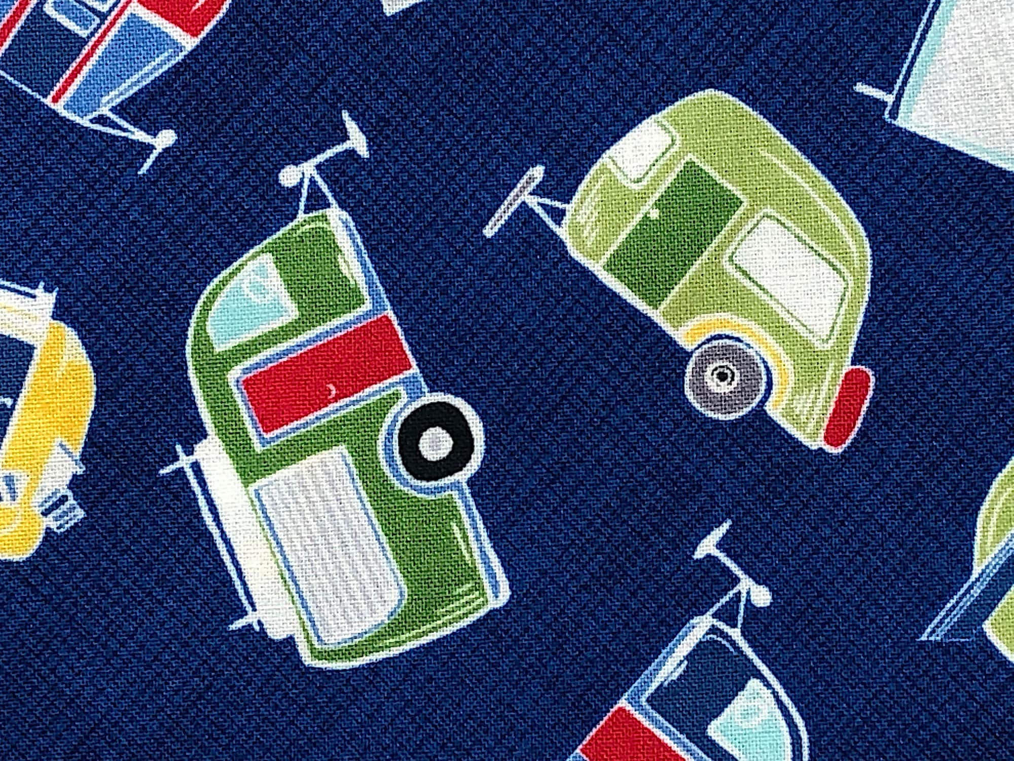 Close up of travel trailers on a blue background.