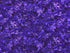 This fabric is part of The Reef collection and is covered with shades of purple, lavender, white and pink turtles.