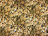 This fabric is covered with shades of brown and beige leaves.
