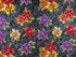 This fabric is part of the Lilyanne collection and has shades of red, yellow and purple lilies.