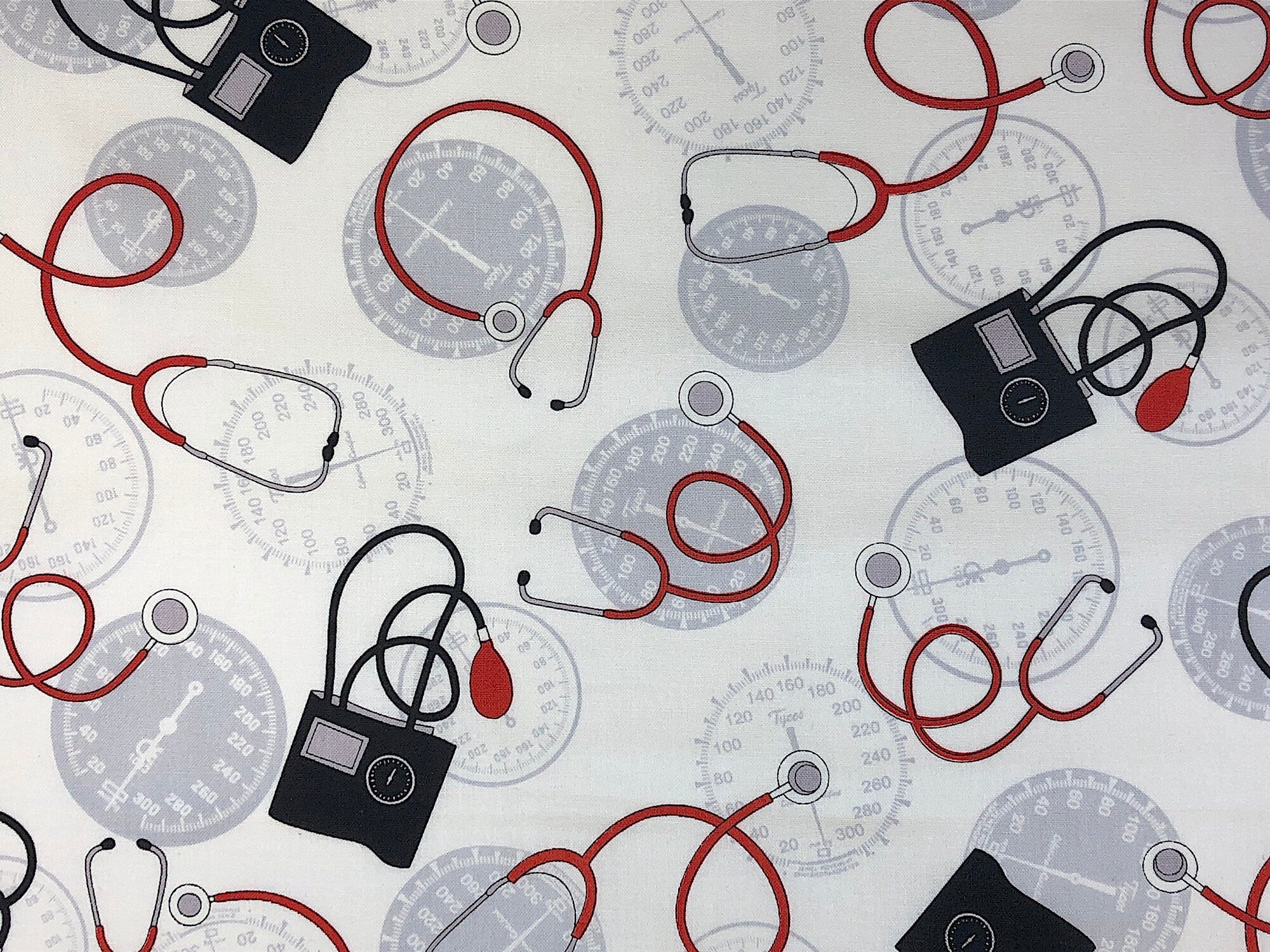 This fabric is called Calling All Nurses and is covered in stethoscopes and blood pressure equipment.