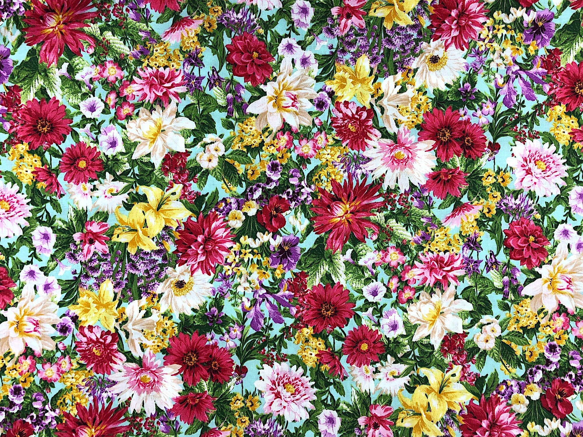 This fabric is called princess passion and is covered with dahlias, lilies and other flowers.