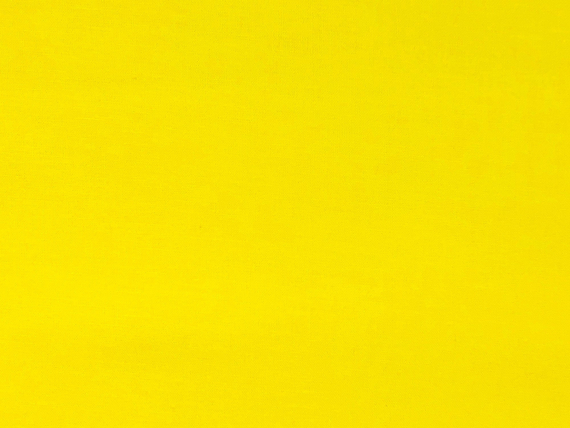 Solid yellow cotton fabric.