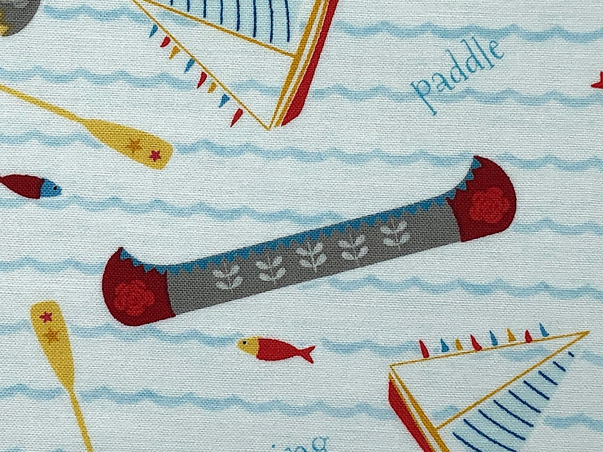 Close up of a canoe and  a fish swimming.