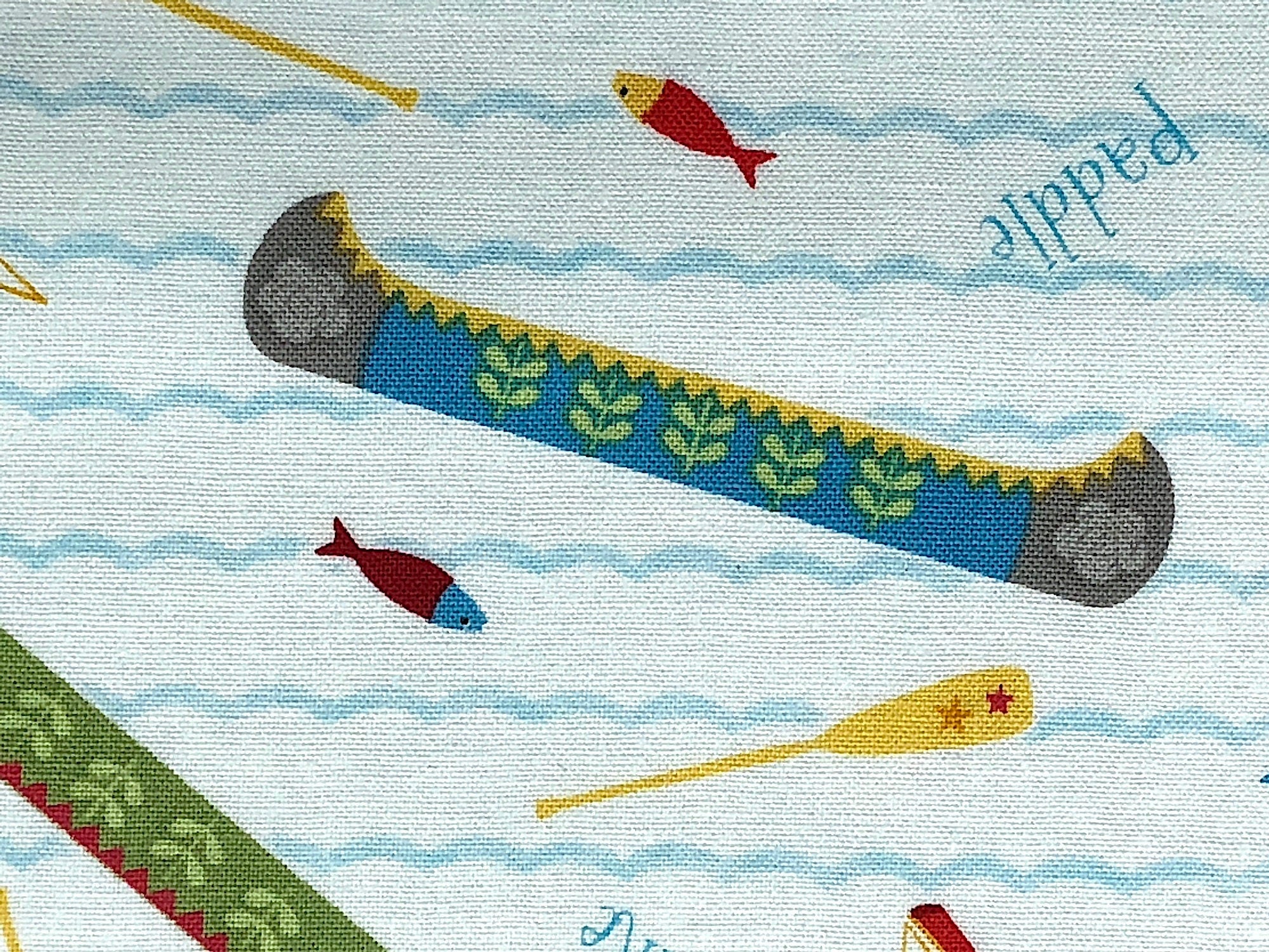 Close up of a canoe and oar.
