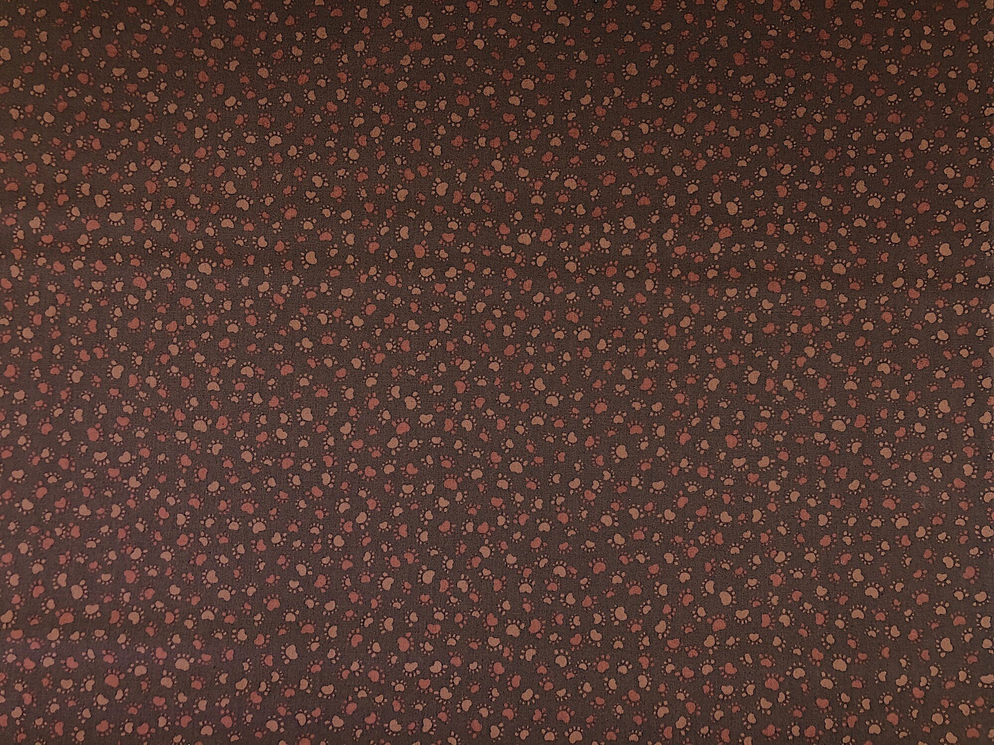 This brown fabric is called Where's The Cat and is covered with brown paw prints.