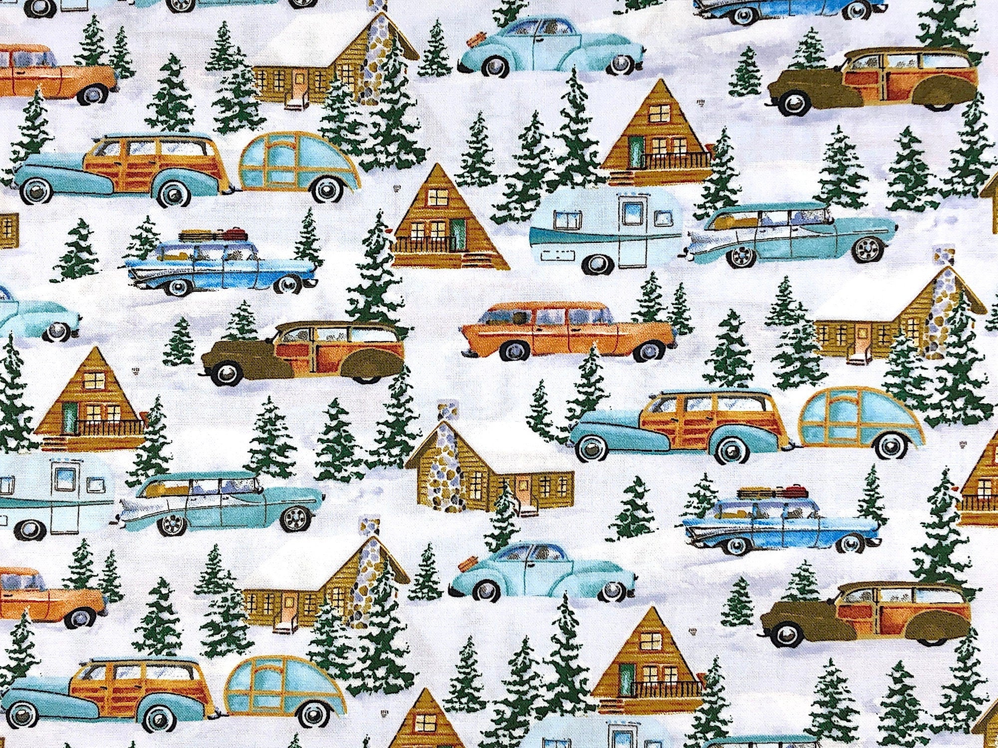 This fabric is called Snowy Woods. This white fabric is covered with snow covered trees, old time cars, some of which are pulling travel trailers. You will also find cabins on this winter fabric.