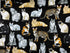 This fabric is called realistic cats and is covered with calico cats, Siamese cats, black cats and more. The background is black.