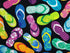 This fabric is called Tropical Flip Flops. This black fabric is covered with flips flops that are green, blue, pink, yellow and purple. Some of the designs on the flip flops are palm trees, hibiscus, circles and more.