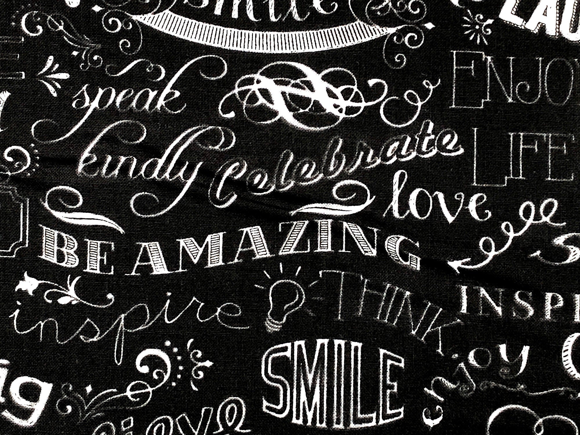 Close up of sayings such as inspire, smile, think, speak kindly and more.