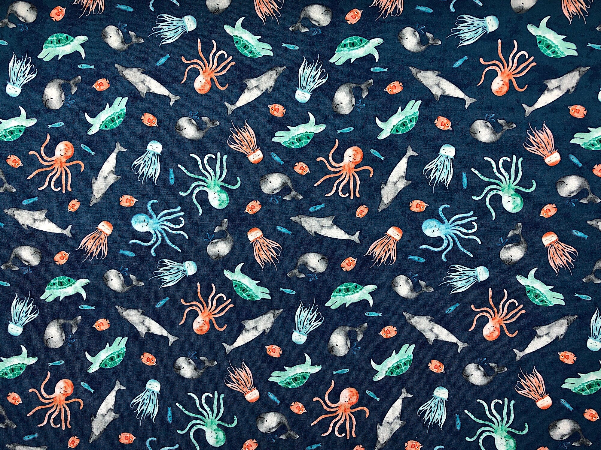 This fabric is called Whaley Loved and is covered with whales, octopus, turtles, dolphins and more.