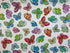 This white fabric is part of the Dazzling Garden Collection and is covered with butterflies. The butterflies are blue, green red, yellow, pink and orange.