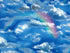 Close up of clouds, rainbows and sky.