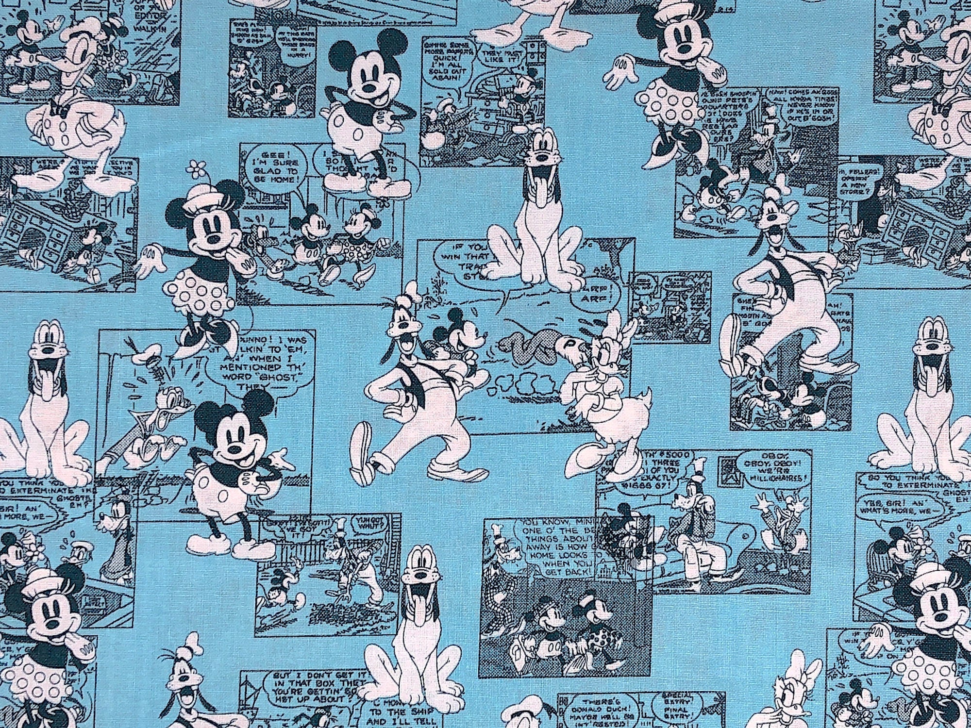 Close up of Mickey Mouse, Pluto, comic strips and more.