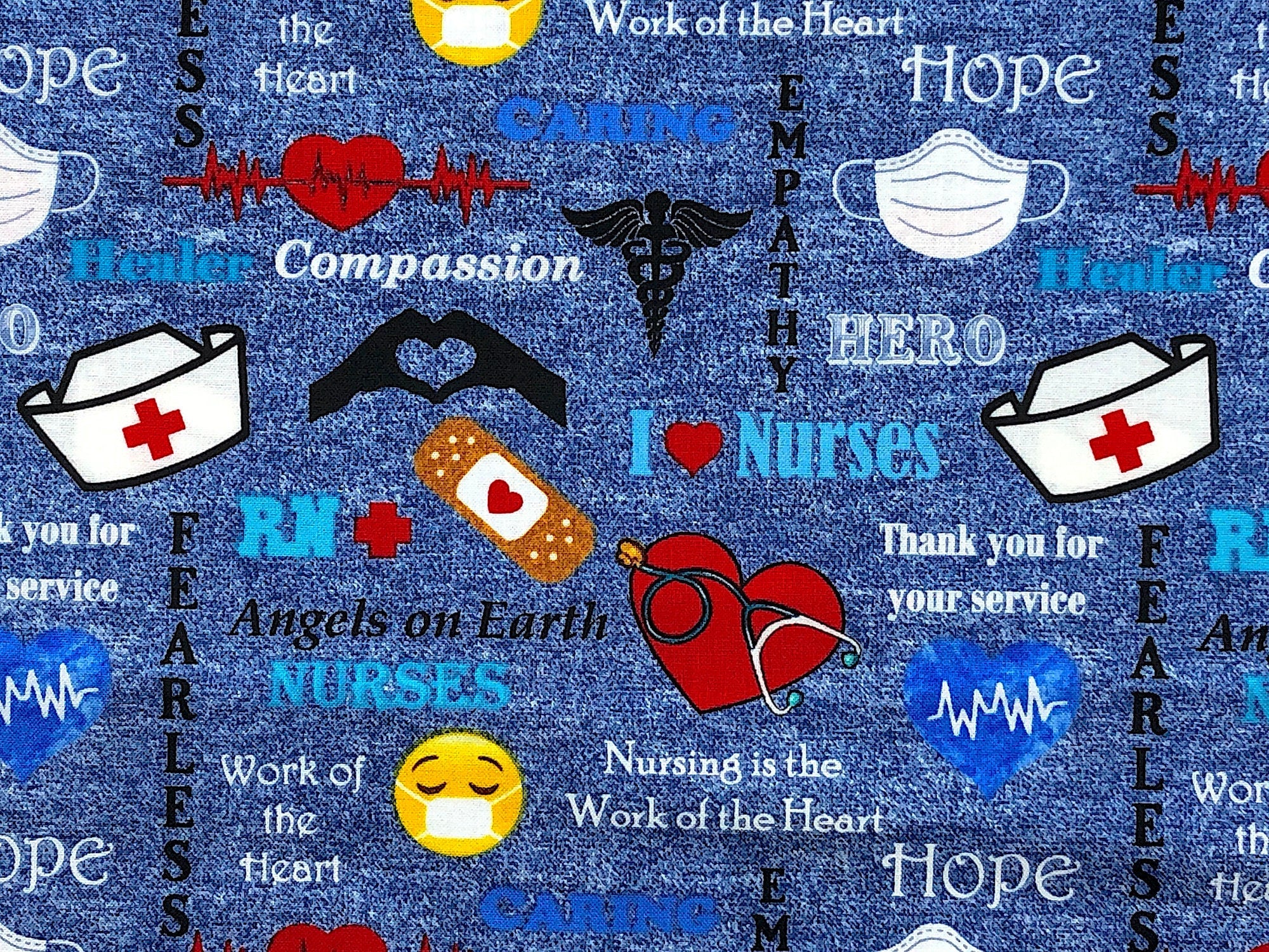 Close up of nurse sayings such as hero, healer, compassion, nursing is the work of the heart and more.