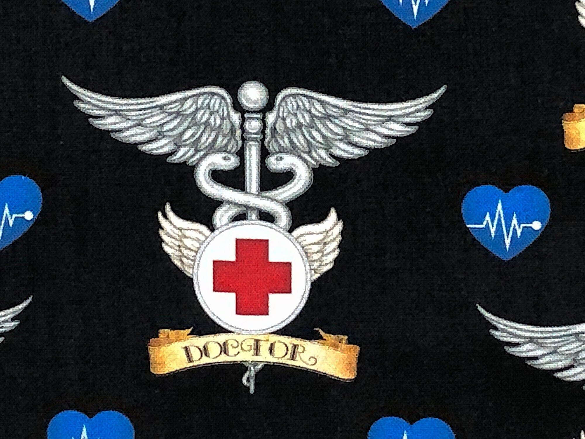Close up of the doctor symbol.