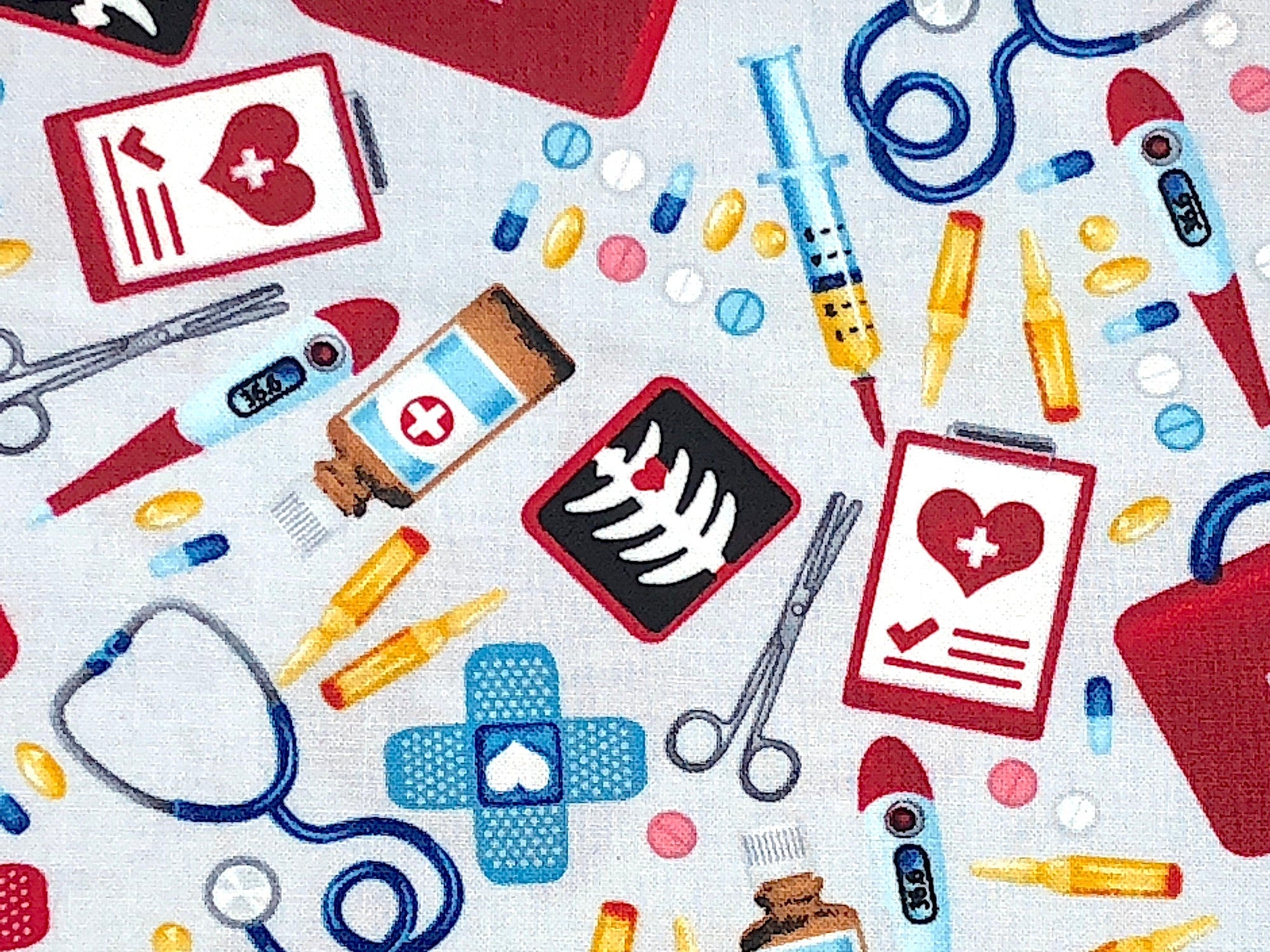 Close up of medicine, stethoscopes, thermometer and more.