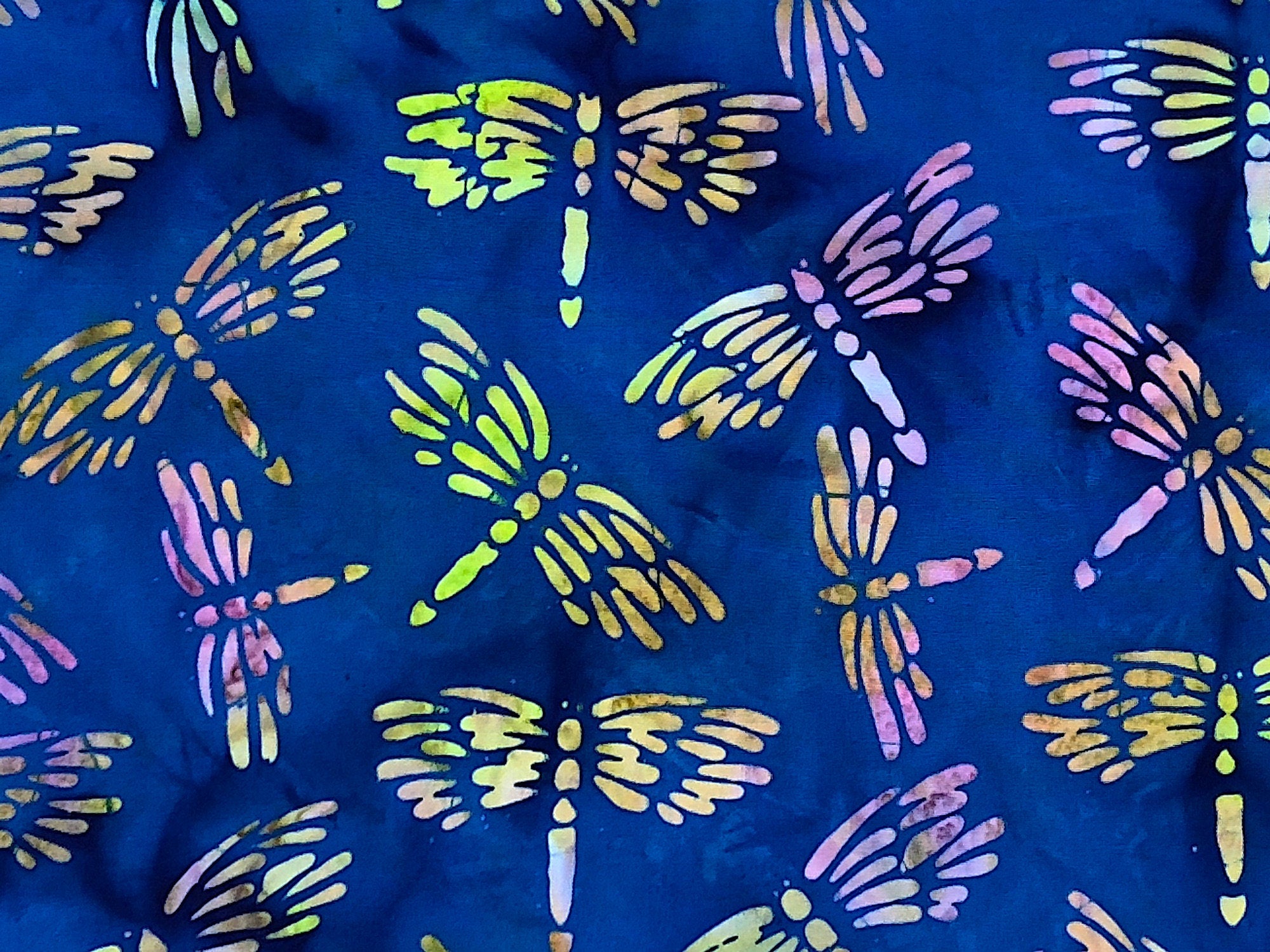 This dragonfly fabric is part of the lemon grass collection by Island Batik. The dragonflies are a combination of yellow, pink, blue and green. This fabric is called Dragonfly Royal Blue