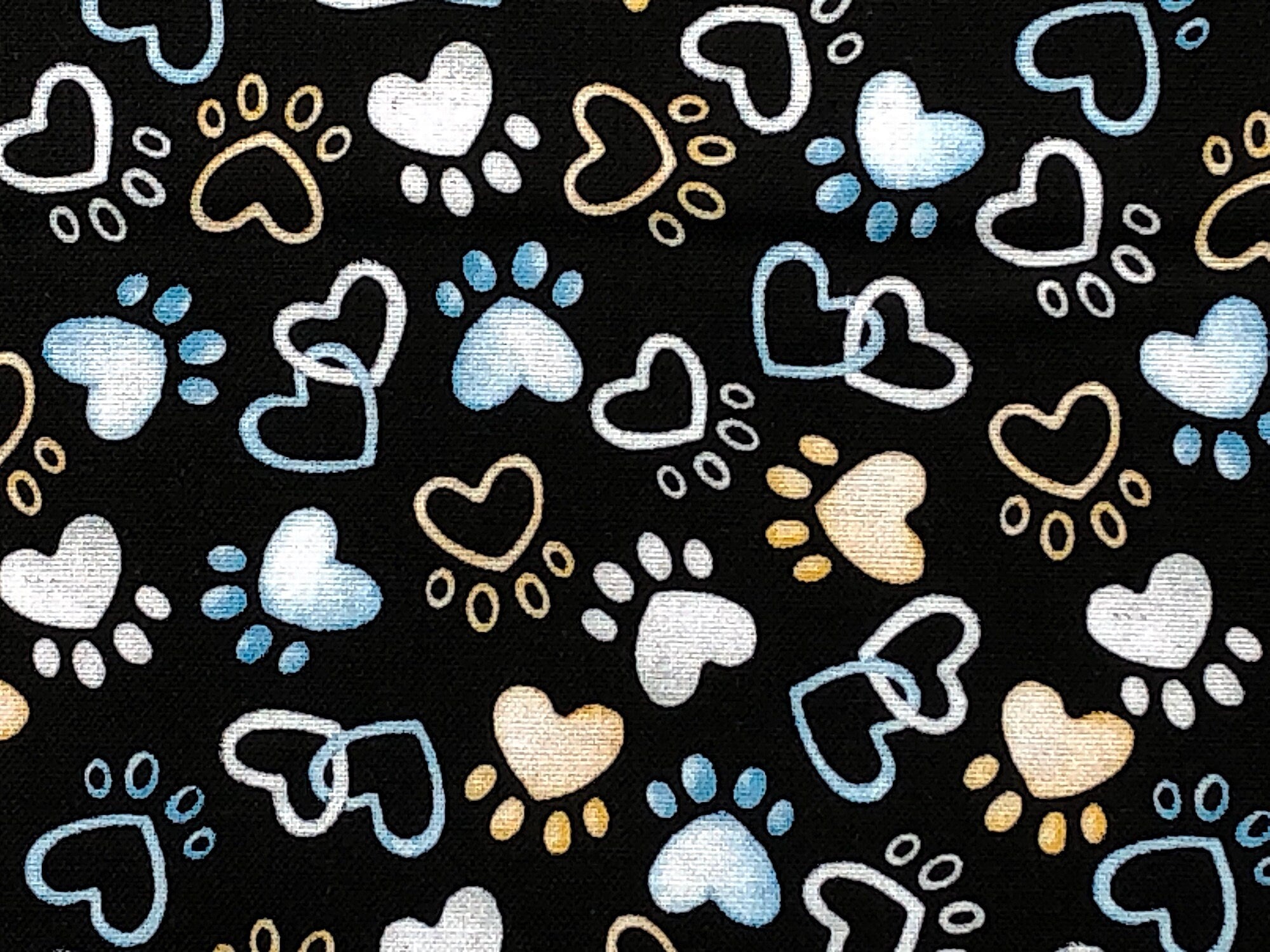 Close up of paw prints and hearts.