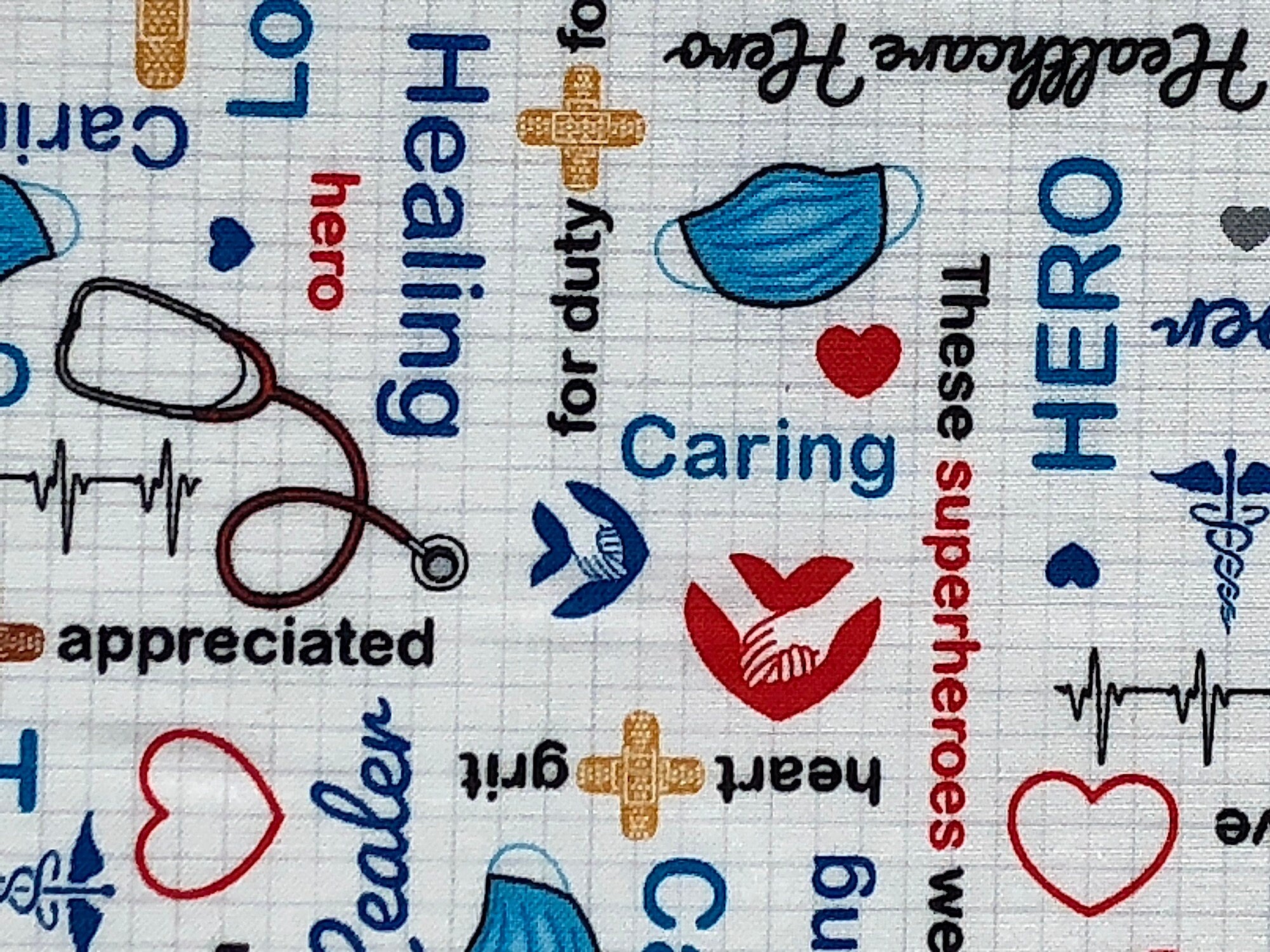 Close up of sayings such as hero, caring, heart, grit, healing and more.
