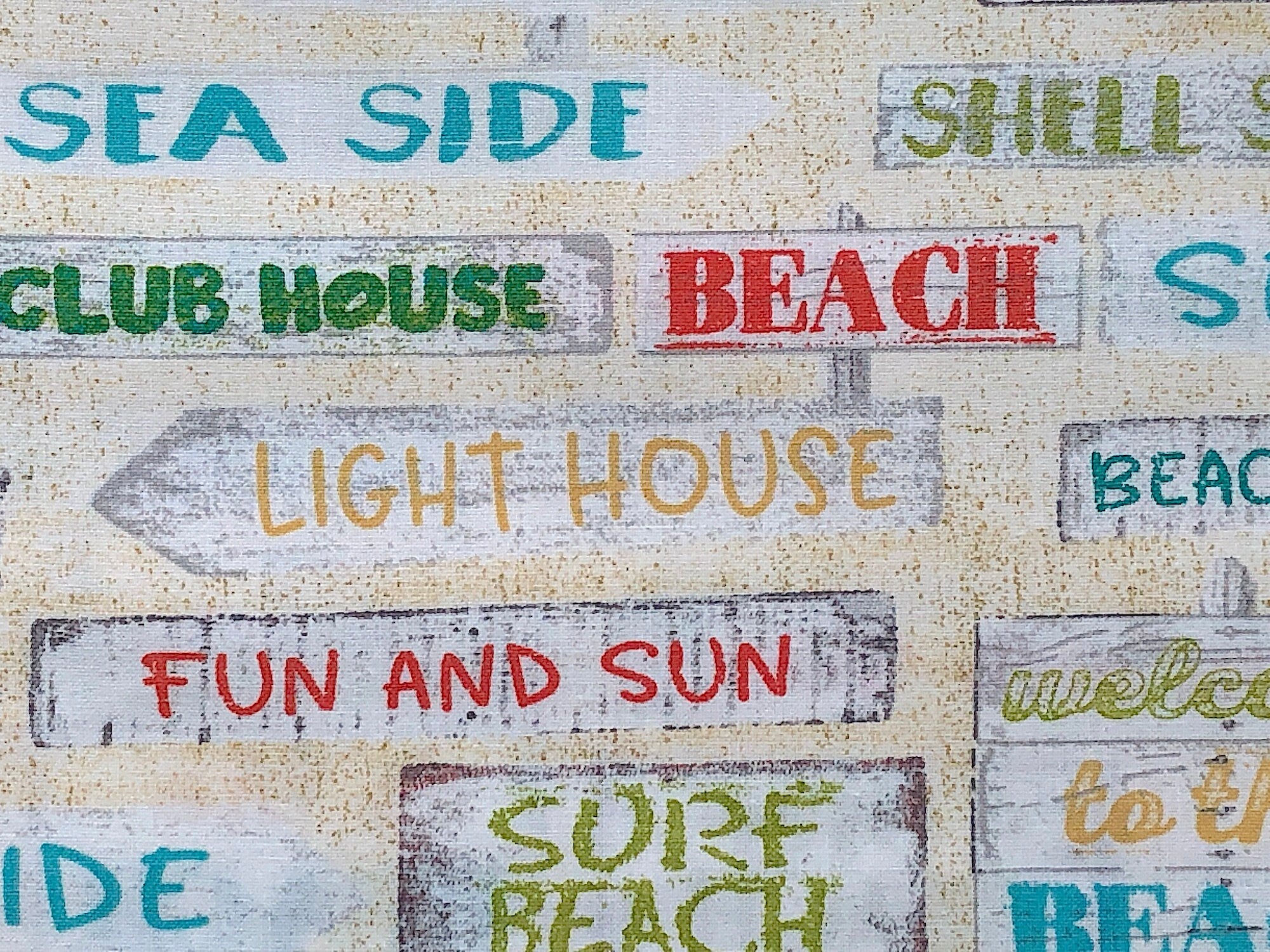 Close up of sayings such as beach, light house, fun and sun and more.