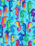 Blue cotton fabric covered with blue, green, yellow and purple seahorses.