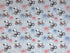 Grey fabric covered with fireworks and Snoopy riding a bike with Woodstock on the back.