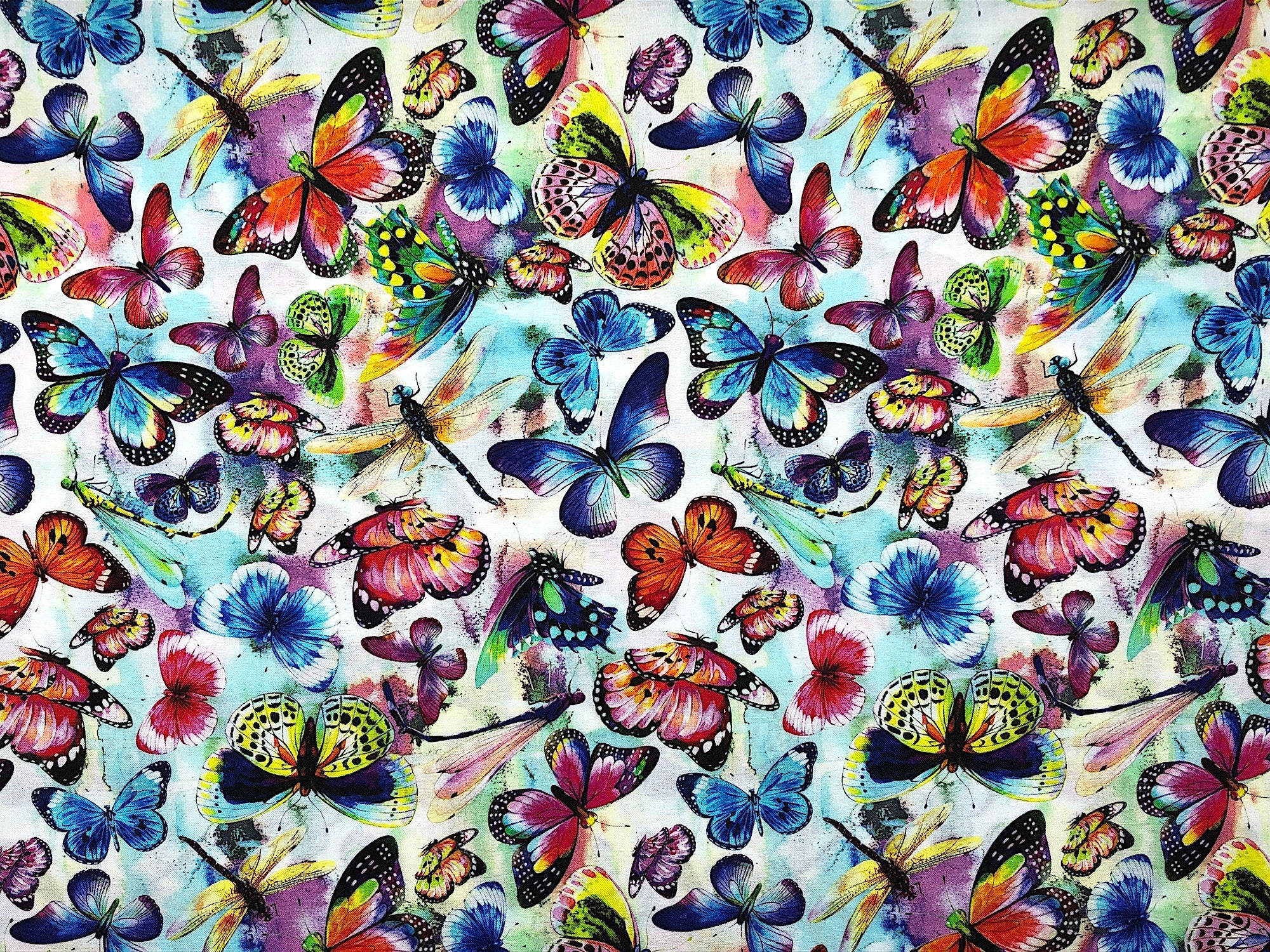 This fabric is called Butterflies multi. There are butterflies in every color of the rainbow and yellow, green and blue dragonflies.