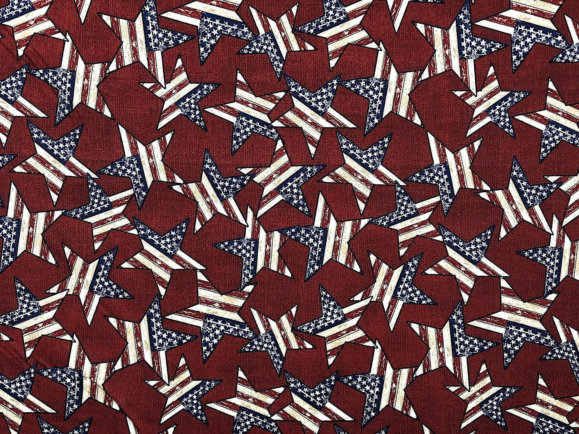 This burgundy fabric is covered with patriotic Stars. This fabric is part of the Patriotic Summer Collection.