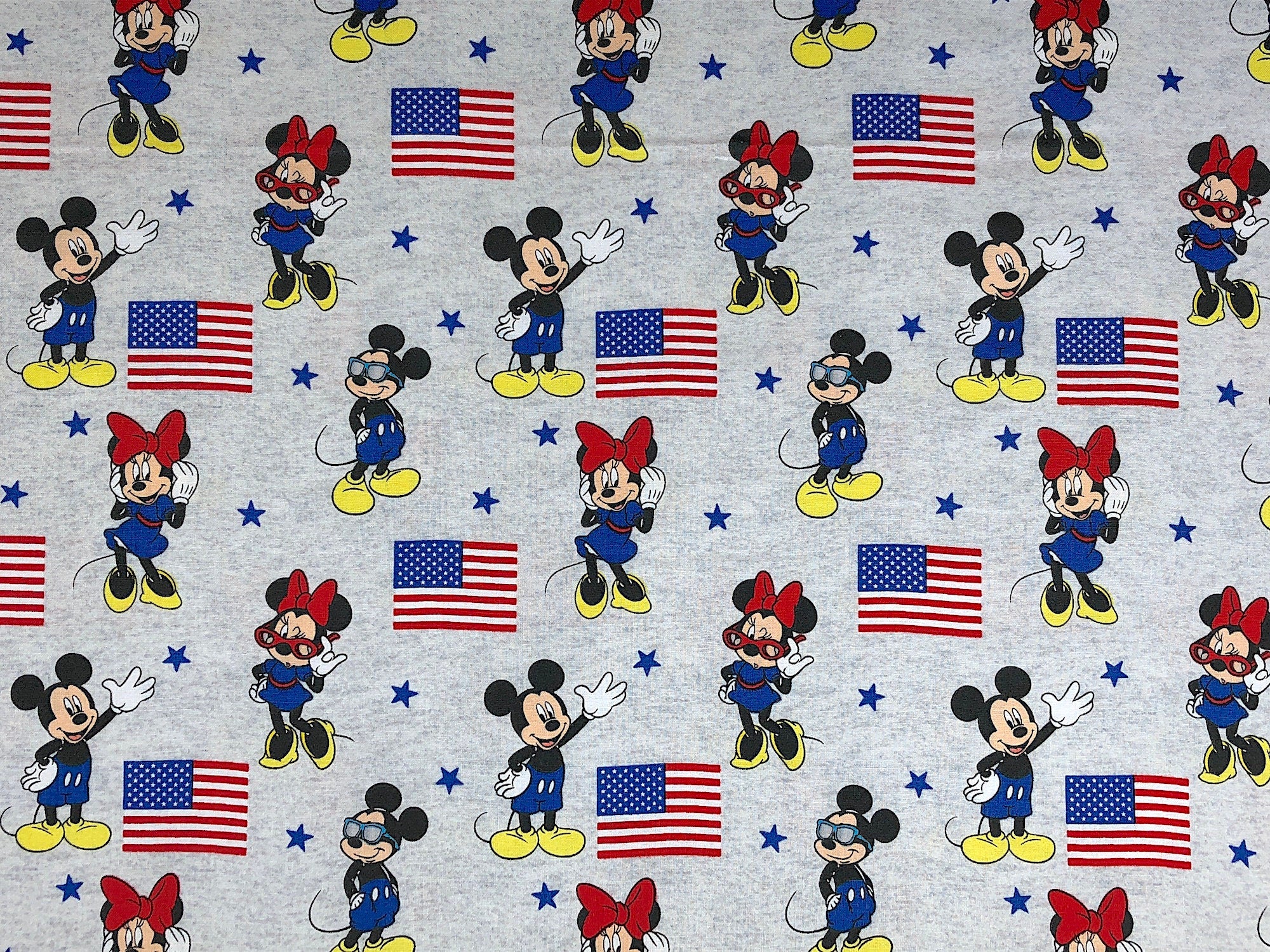 This Patriotic fabric is covered with Mickey and Minnie Mouse and USA flags.