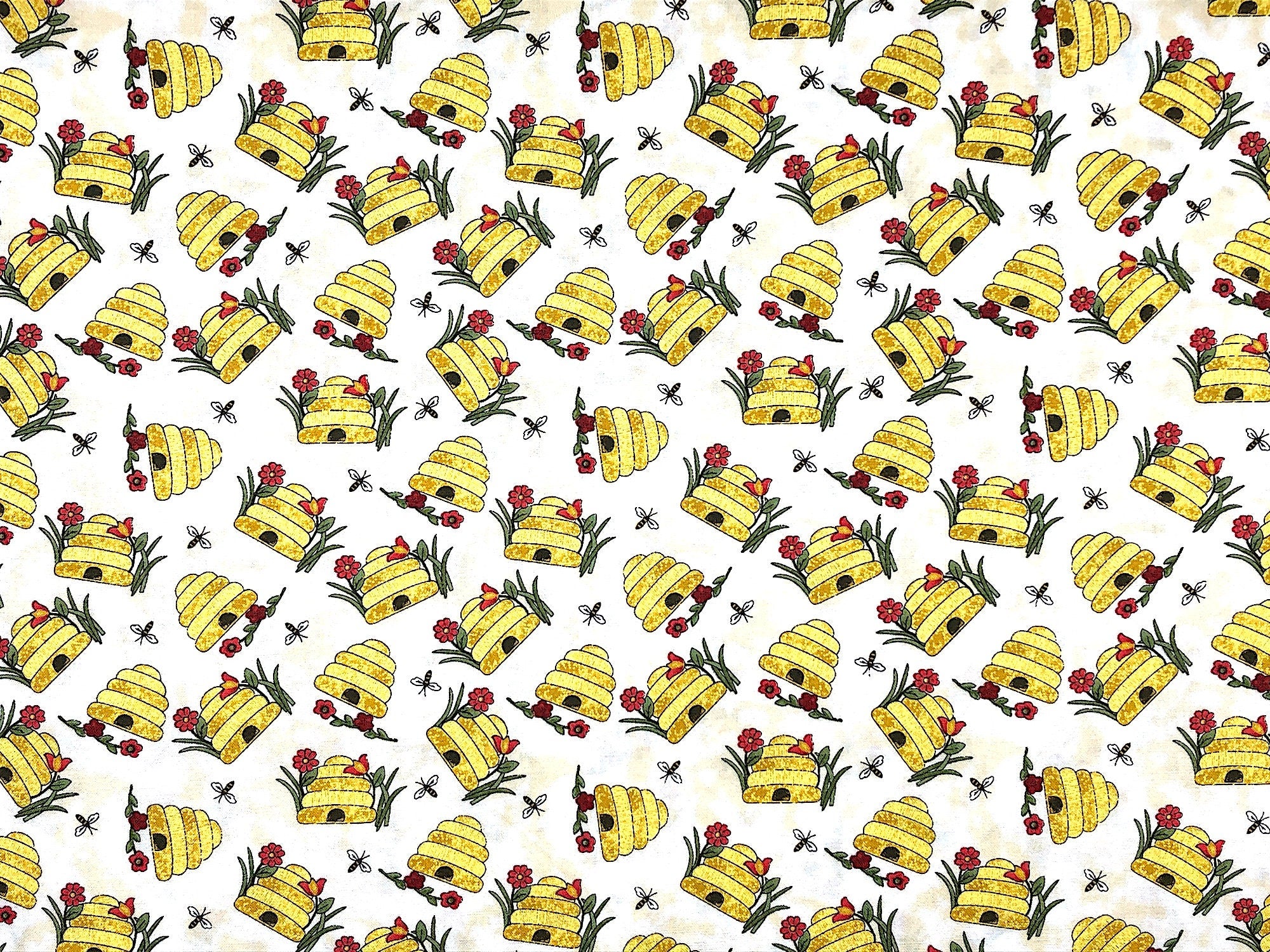 This fabric is called Bee Skep with Bees Vanilla and is covered with bee hives, bees and flowers. This fabric is part of the Colorful Cats collection.