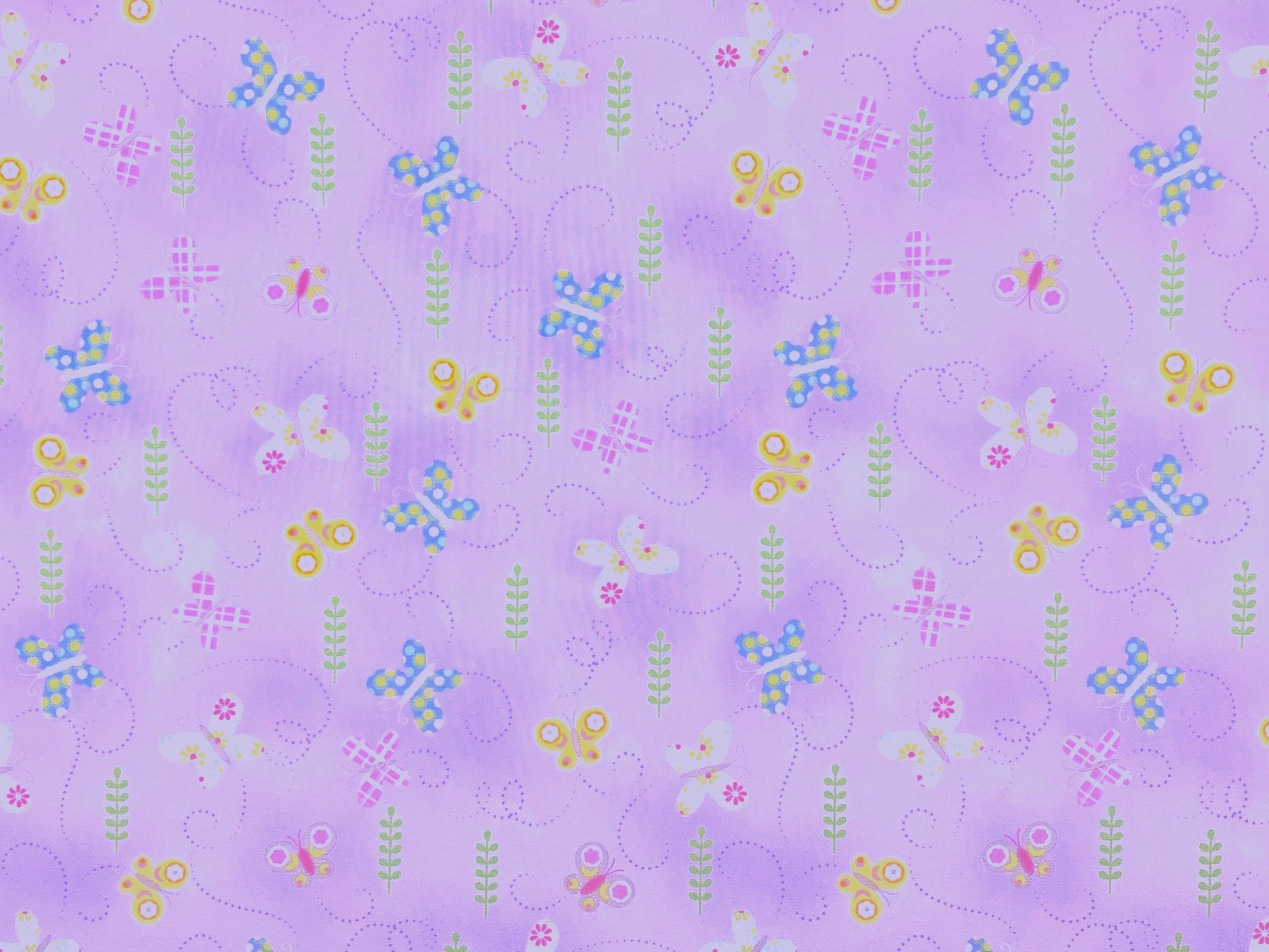 This fabric is a called Springtime Butterflies and is covered with butterflies. The butterflies are a mix of blue, yellow, pink, white and green. This fabric is part of the Hippity Hoppity collection