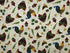 Cotton fabric covered with roosters, fruit and vegetables such as apples and corn.