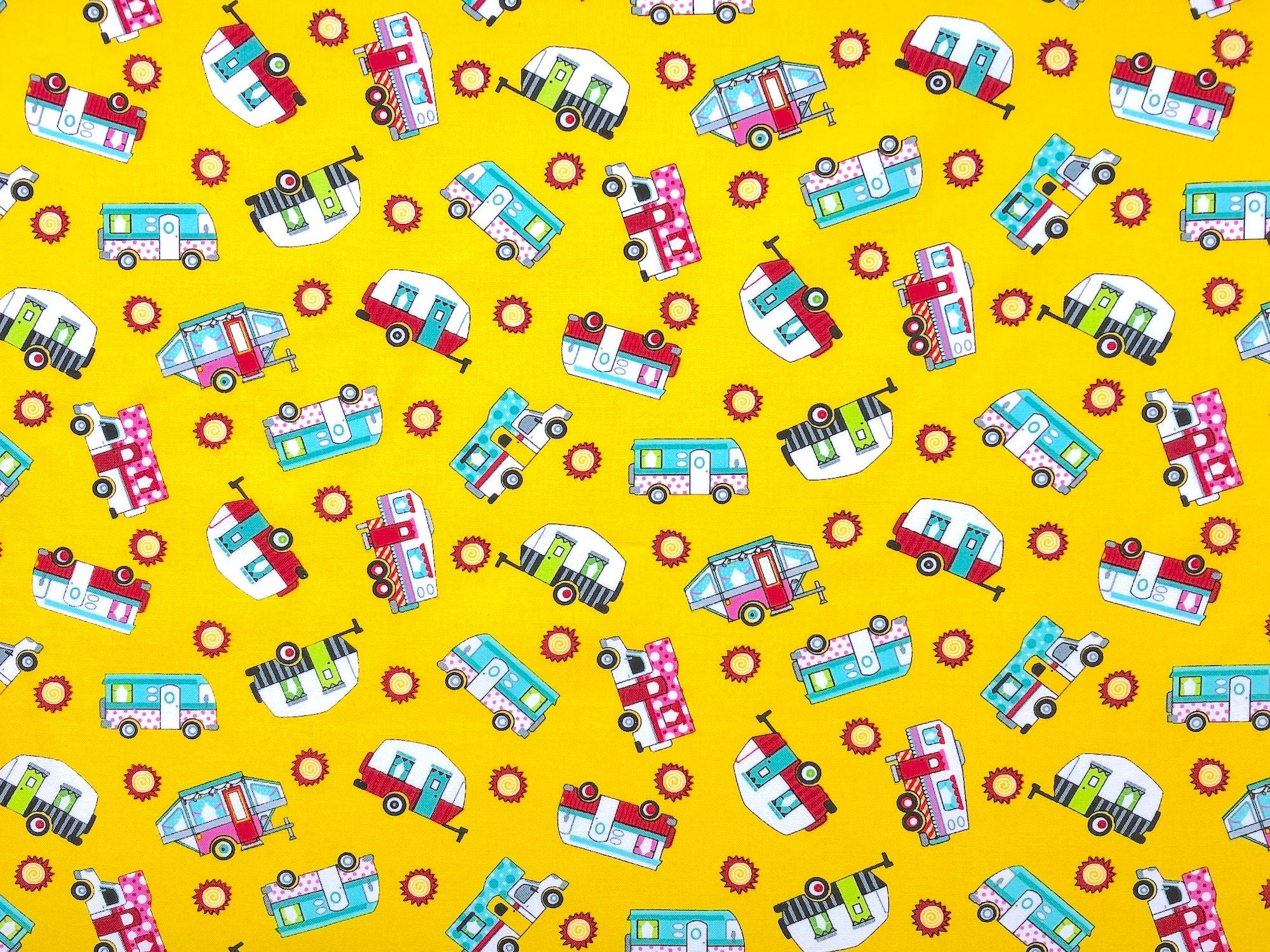 This fabric is called Tossed Campers Red and is covered with travel trailers, campers on trucks, 5th wheels pop up tents, 5th wheels and more.. This fabric is part of the Roaming Holiday Collection by Pam Bocko.