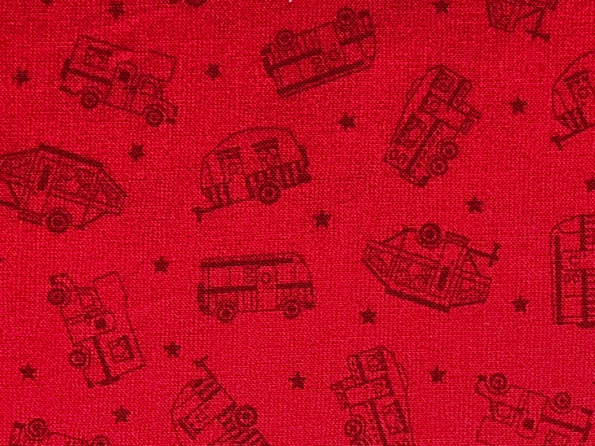 Close up of travel trailers on a red background.
