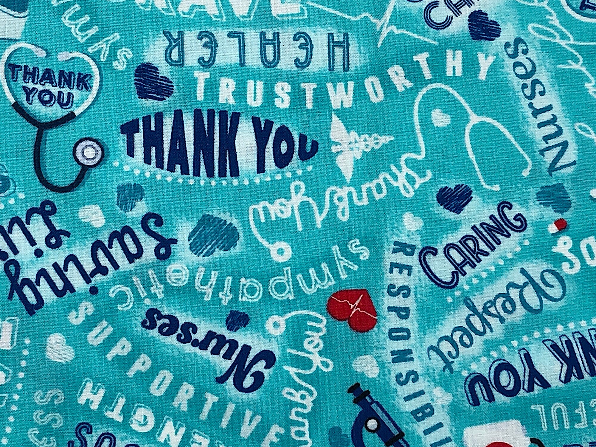 Close up of sayings such as caring, nurses, supportive, thank you and more.