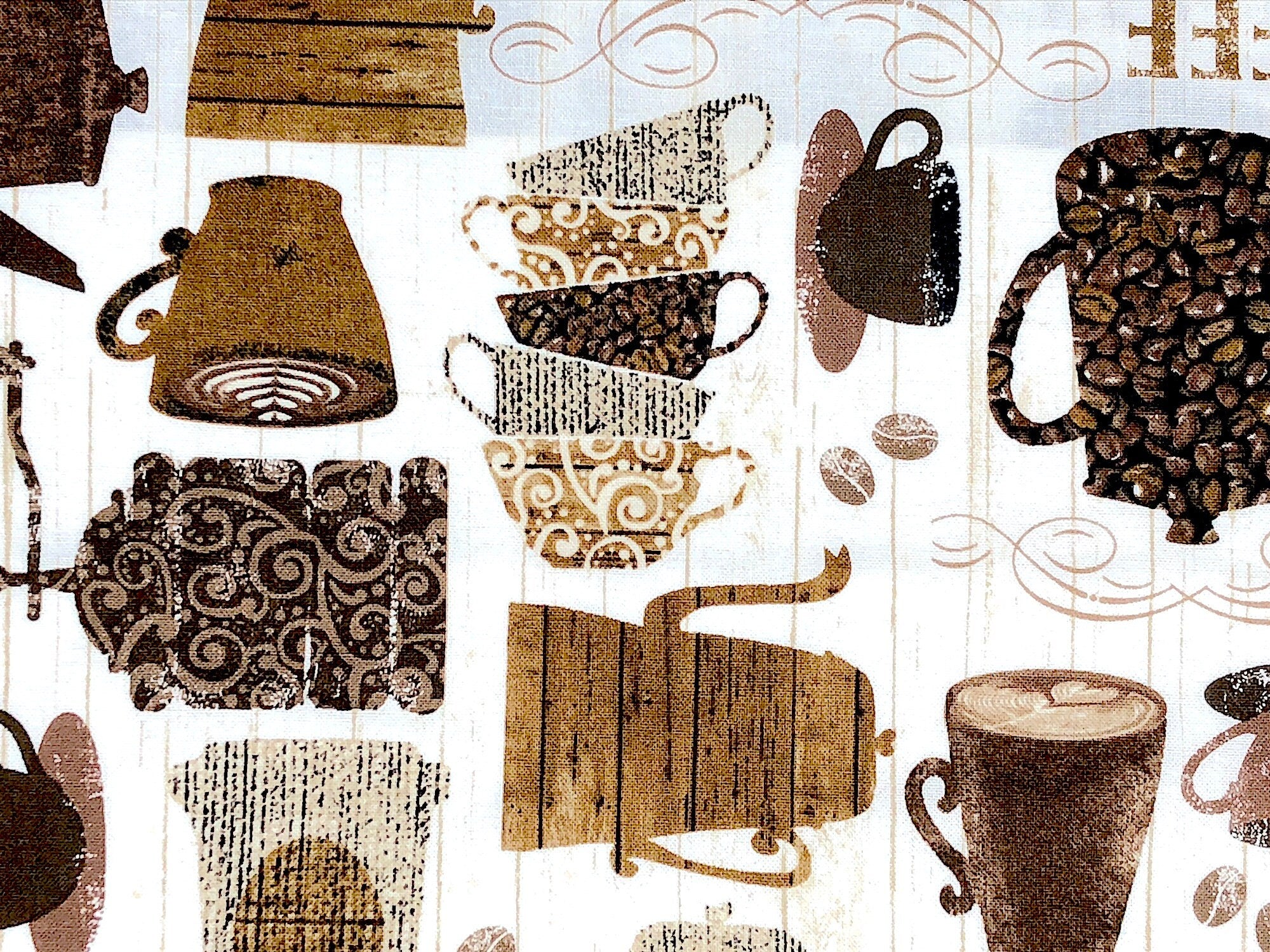 Close up of coffee pots, coffee cups, beans and more.