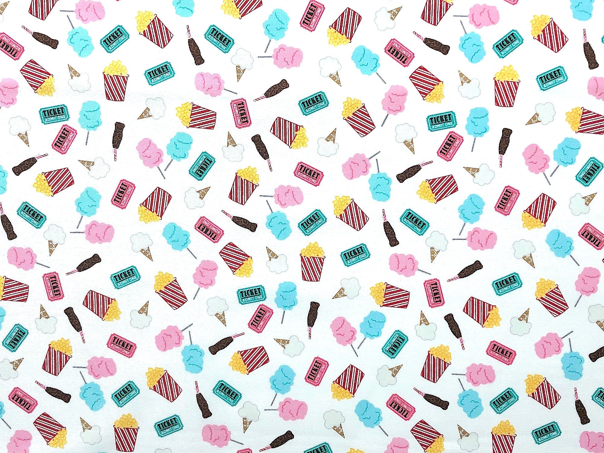 This fabric is called Fun Snacks and is covered with popcorn, sodas, movie tickets, ice cream cones and more. This white fabric is part of the Vintage Boardwalk collection.