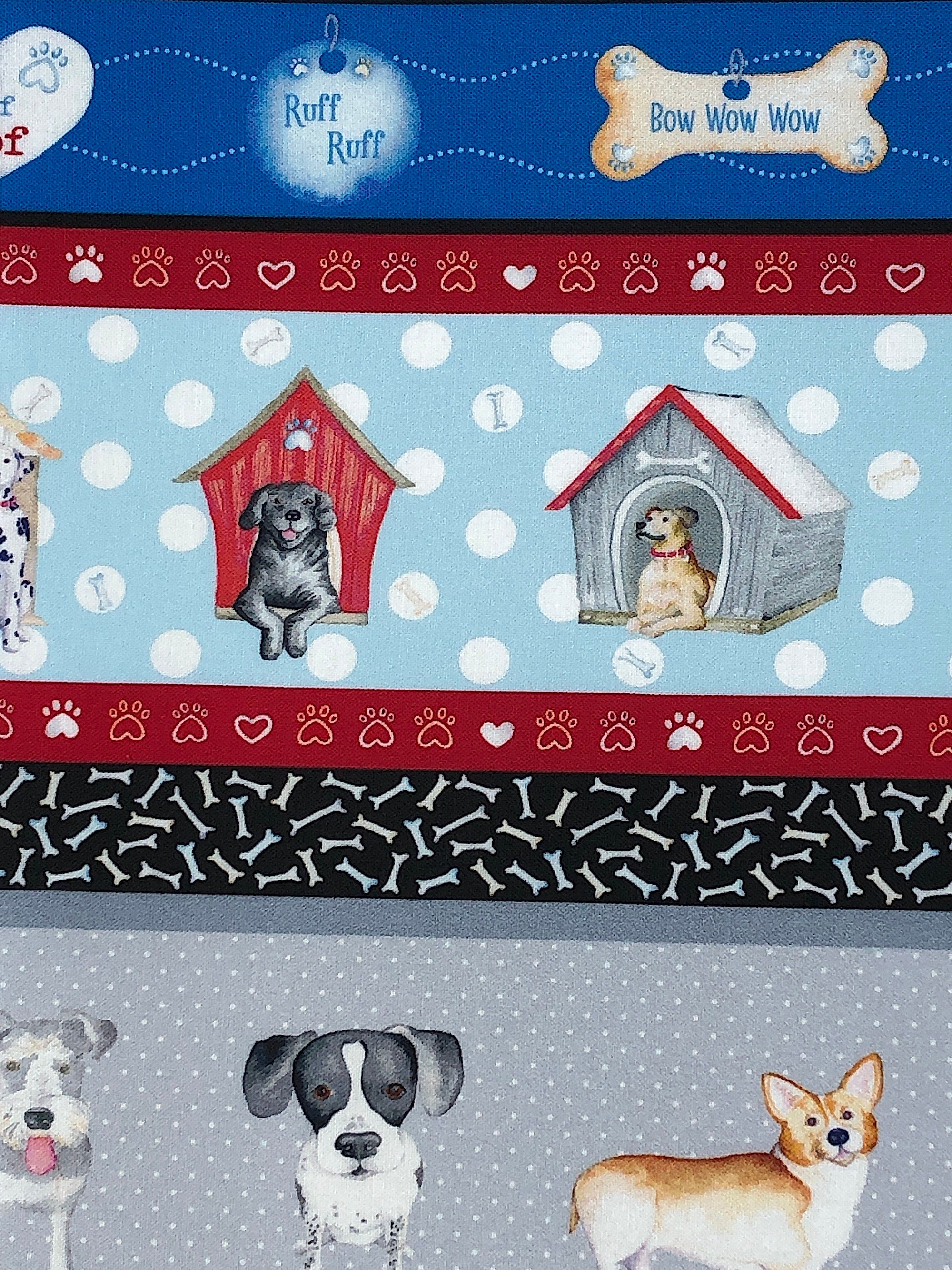 Close up of dogs in dog houses and stripes of paw prints and dog bones.