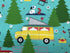 Close up of a yellow camping van, trees, dog flowers and more.