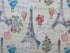 Fabric covered with Eifel towers, hot air balloons, flowers and more.