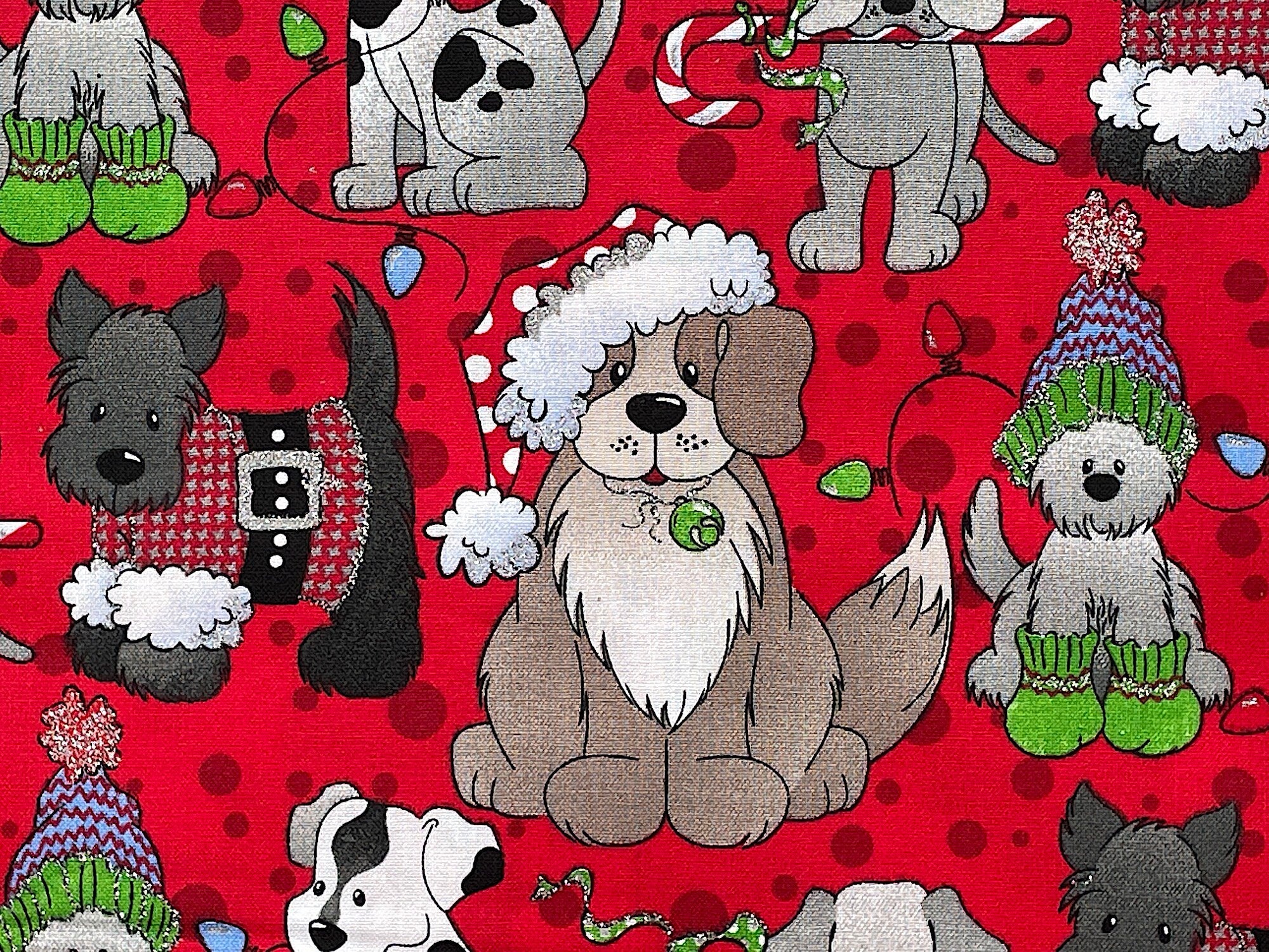Close up of red cotton fabric covered with dogs wearing hats.