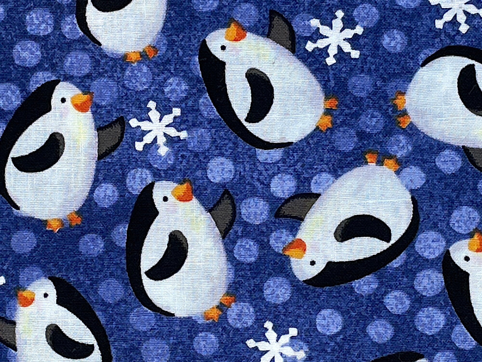 Close up of penguins and snowflakes.